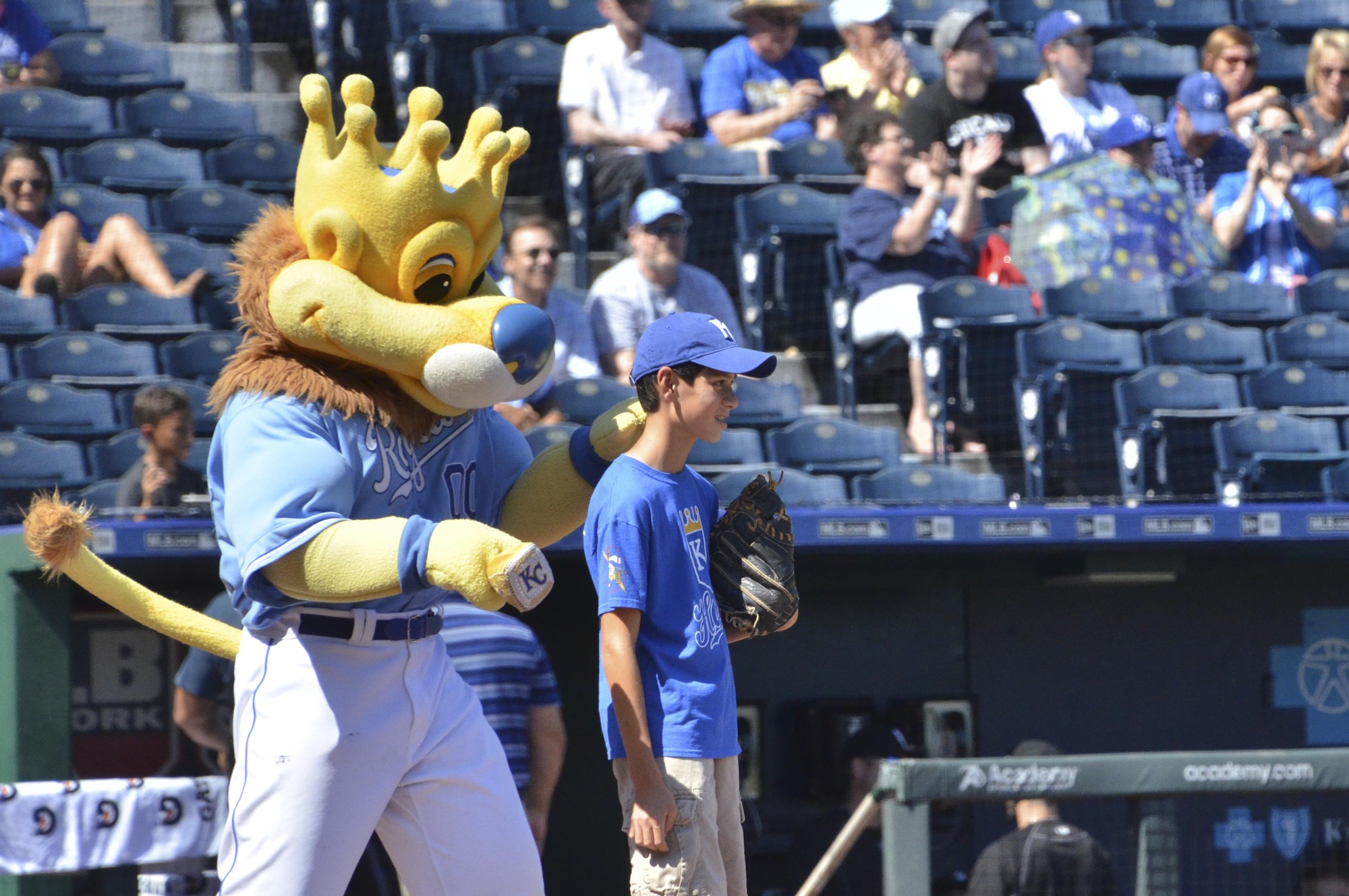 Sluggerrr, the Kansas City Royals mascot, preps Alex Marks before his father, a 303rd Fighter Squadron pilot, throws him the opening pitch for the Royals game at Kauffman Stadium in Kansas City, Mo., Sept. 19, 2016. (U.S. Air Force photo/Senior Airman Missy Sterling)