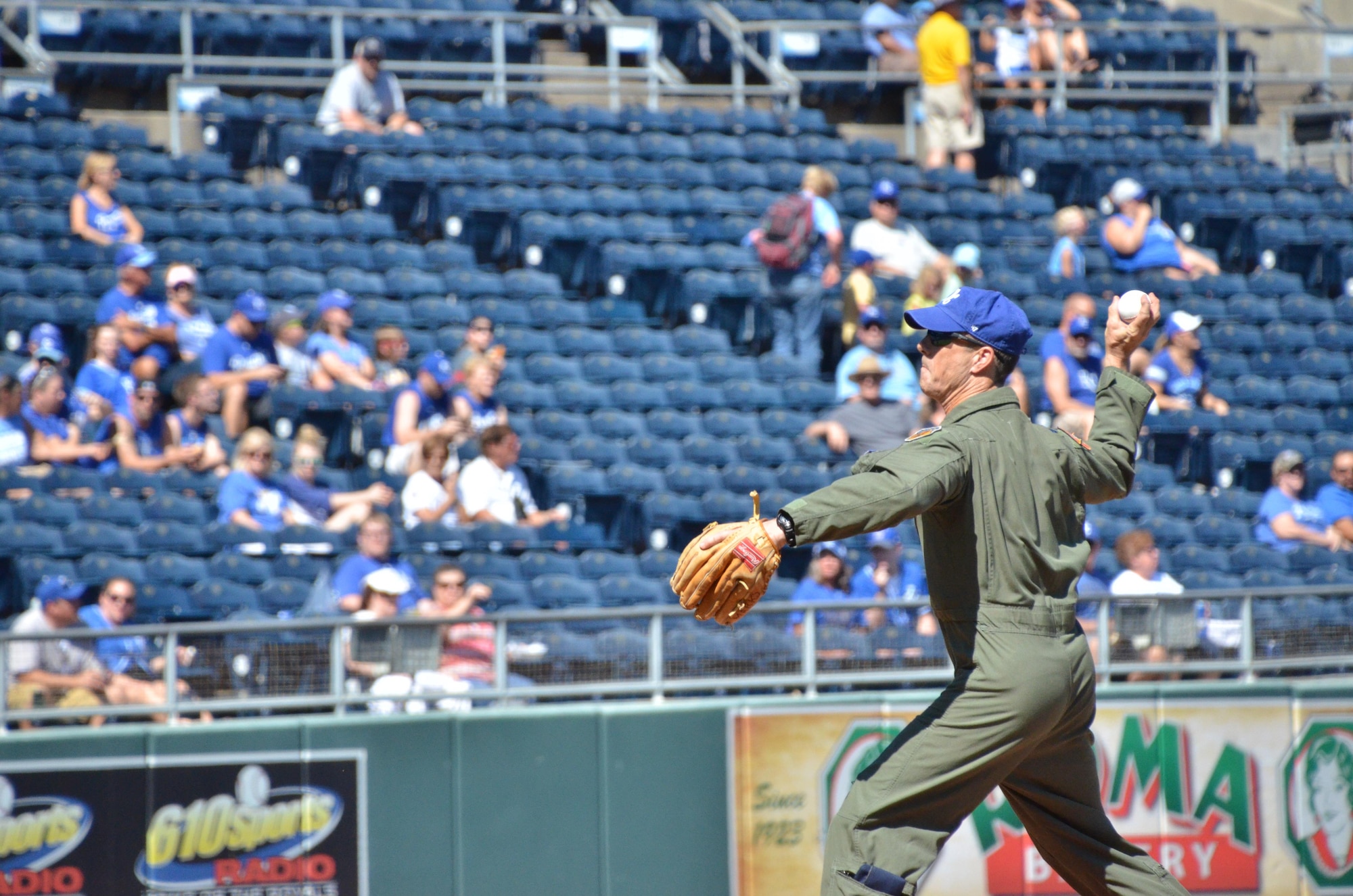 U.S. Air Force Lt. Col. John Marks, 303rd Fighter Squadron pilot, throws the opening pitch at Kauffman Stadium in Kansas City, Mo., Sept. 19, 2016. Marks is the current highest time A-10 Thunderbolt II pilot with over 6,900 total hours including over 980 combat hours. (U.S. Air Force photo/Senior Airman Missy Sterling)