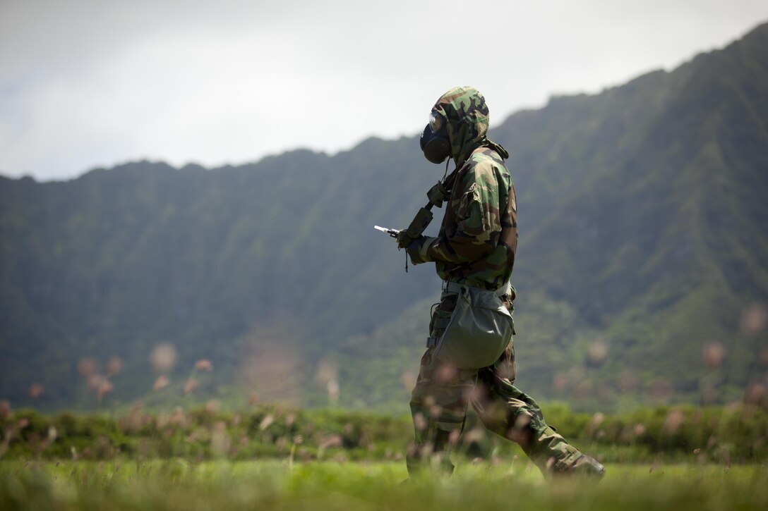 U.S. Marine Corps Lance Cpl. Dustin J. Robbins, assault amphibious vehicle crewman assigned to Combat Assault Company, 3rd Marine Regiment, participates in surveying for chemical contamination during the Chemical, Biological, Radiological, and Nuclear (CBRN) Reconnessaince and Surveillance Training Course aboard Marine Corps Training Area Bellows, Hawaii, Aug. 11, 2016. Select Marines within the Regiment under-went the training designed to equip them with the capability to confirm or deny CBRN presence on the battlefield. 