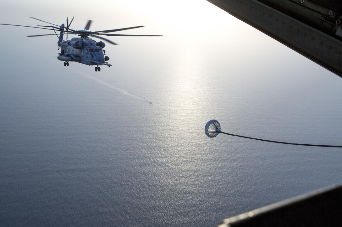 A CH-53E Super Stallion  from the 22nd Marine Expeditionary Unit soars across the Red Sea to rendezvous with a C-130 Hercules organic to Special Purpose Marine Air-Ground Task Force-Crisis Response-Central Command for air-to-air refueling operations July 30, 2016. VMGR-352 hosted aerial refuel training for multiple CH-53s demonstrating synergy between SPMAGTF-CR-CC and 22nd MEU.  SPMAGTF-CR-CC is currently forward deployed in several host nations, with the ability to respond to a variety of contingencies rapidly and effectively.