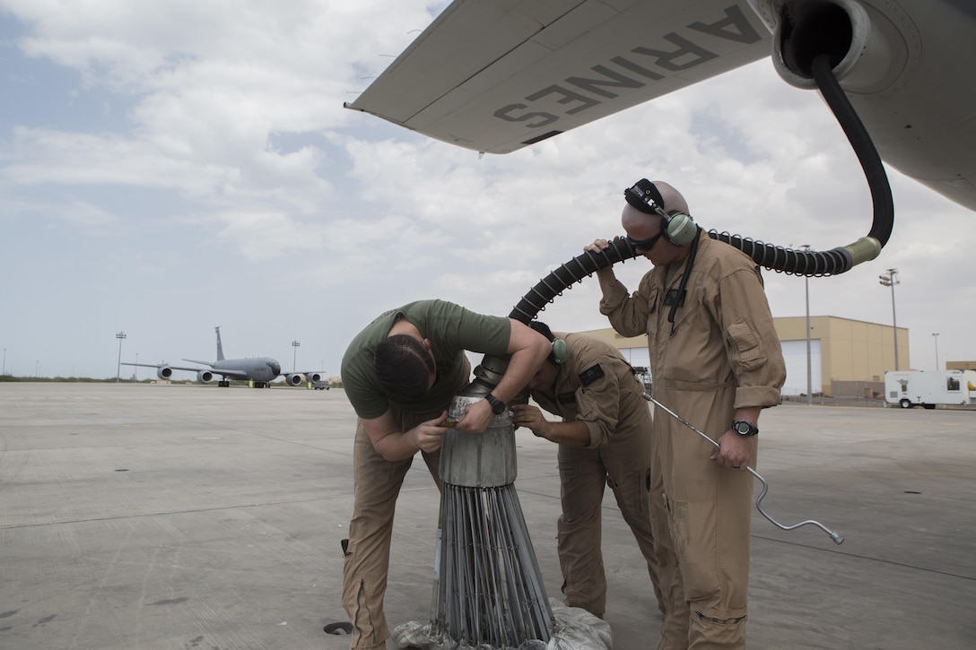 Flight crew with Marine Aerial Refueler Transport Squadron-352, Special Purpose Marine Air-Ground Task Force-Crisis Response-Central Command, assemble a refueling hose and drogue for refueling operations over the Red Sea, July 30, 2016. VMGR-352 supported aerial refuel training for multiple 22nd MEU CH-53s demonstrating synergy between the two MAGTFs. SPMAGTF-CR-AF is a self-sustaining expeditionary unit designed to provide crisis response capabilities throughout U.S. Central Command, using organic aviation, logistical and ground combat assets, to include embassy reinforcement and tactical recovery of aircraft and personnel.