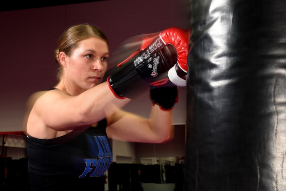 COLORADO SPRINGS, Colo. – Senior Airman Rose Gudex, 21st Space Wing Public Affairs photojournalist, relieves stress through kickboxing at a local gym in Colorado Springs, Colo., Sept. 14, 2016. After going through some difficult situations in her life, Gudex turned to fitness as a way to channel frustrations. (U.S. Air Force photo by Airman 1st Class Dennis Hoffman)