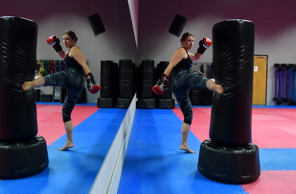 COLORADO SPRINGS, Colo. – Senior Airman Rose Gudex, 21st Space Wing Public Affairs photojournalist, relieves stress through kickboxing at a local gym in Colorado Springs, Colo., Sept. 14, 2016. After going through some difficult situations in her life, Gudex turned to fitness as a way to channel frustrations. (U.S. Air Force photo by Airman 1st Class Dennis Hoffman)