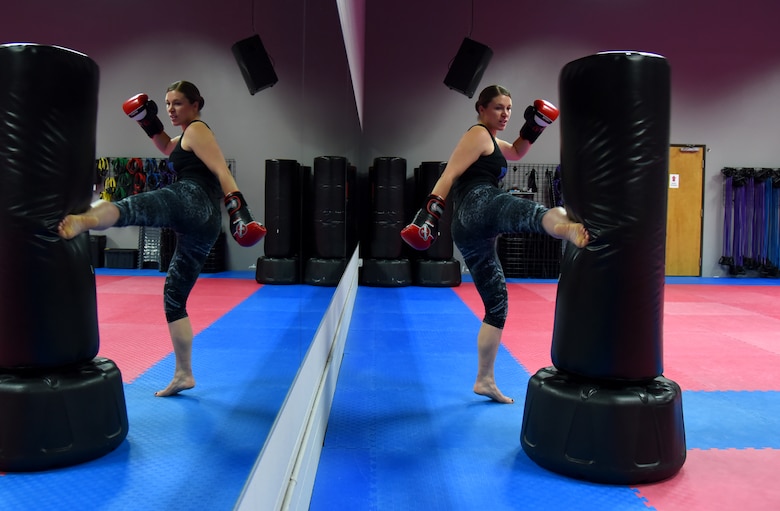 COLORADO SPRINGS, Colo. – Senior Airman Rose Gudex, 21st Space Wing Public Affairs photojournalist, relieves stress through kickboxing at a local gym in Colorado Springs, Colo., Sept. 14, 2016. After going through some difficult situations in her life, Gudex turned to fitness as a way to channel frustrations. (U.S. Air Force photo by Airman 1st Class Dennis Hoffman)