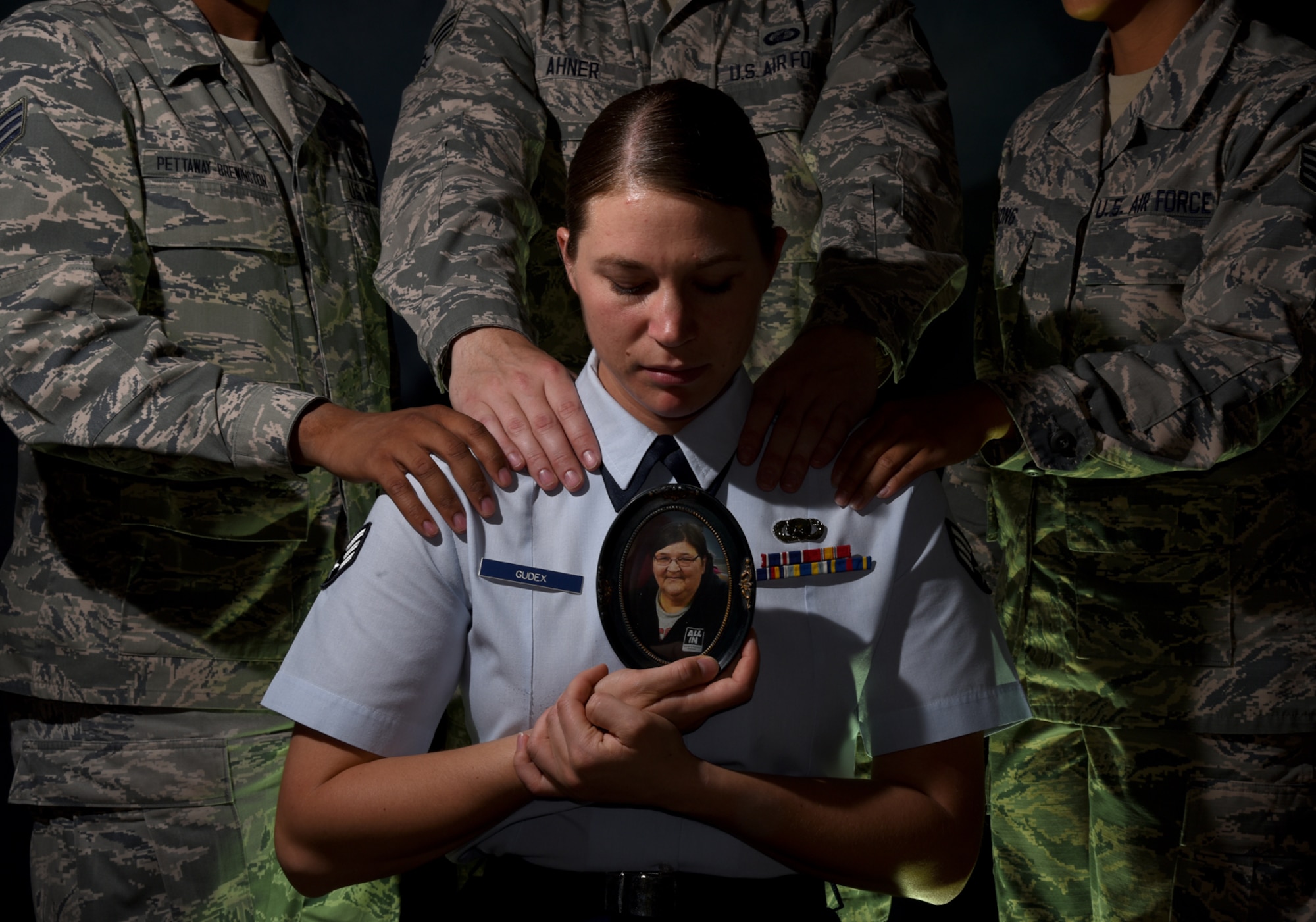 PETERSON AIR FORCE BASE, Colo. – Senior Airman Rose Gudex, 21st Space Wing Public Affairs photojournalist, surrounds herself with her Air Force family from Peterson Air Force Base, Colo., during difficult times. Gudex didn’t have a solid support system before joining the military, but found a family in her brothers and sisters in arms. (U.S. Air Force photo by Airman 1st Class Dennis Hoffman)