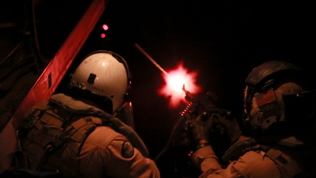 U.S. Marines with Marine Medium Tiltrotor Squadron-363, Special Purpose Marine Air-Ground Task Force-Crisis Response-Central Command, fire an M240 medium machine gun from the back of an MV-22 Osprey during aerial gunnery training over the Arabian Gulf,  July 27, 2016. The squadron provides SPMAGTF-CR-CC with assault support, as well as transport of combat troops, supplies and equipment during expeditionary, joint or combined operations. SPMAGTF – CR – CC is a self-sustaining expeditionary unit, designed to provide a broad range of crisis response capabilities throughout the Central Command area of responsibility, using organic aviation, logistical, and ground combat assets, to include embassy reinforcement and tactical recovery of aircraft and personnel. (Photo by Cpl. Danielle Rodrigues/Released)