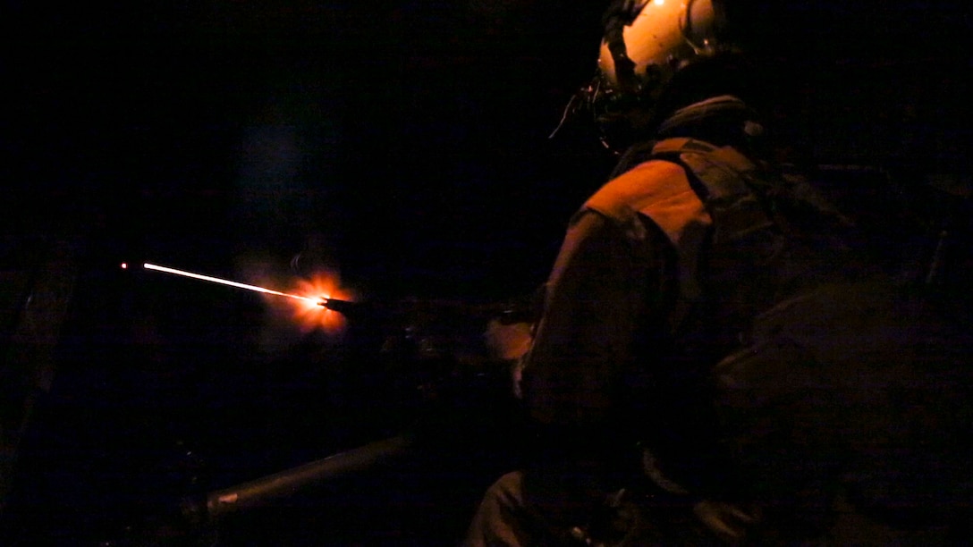 A U.S. Marine with Marine Medium Tiltrotor Squadron-363, Special Purpose Marine Air-Ground Task Force-Crisis Response-Central Command, fires an M240 medium machine gun from the back of an MV-22 Osprey during aerial gunnery training over the Arabian Gulf, July 27, 2016. The squadron provides SPMAGTF-CR-CC with assault support, as well as transport of combat troops, supplies and equipment during expeditionary, joint or combined operations. SPMAGTF – CR – CC is a self-sustaining expeditionary unit, designed to provide a broad range of crisis response capabilities throughout the Central Command area of responsibility, using organic aviation, logistical, and ground combat assets, to include embassy reinforcement and tactical recovery of aircraft and personnel. (Photo by Cpl. Danielle Rodrigues)