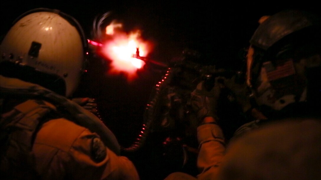 U.S. Marines with Marine Medium Tiltrotor Squadron-363, Special Purpose Marine Air-Ground Task Force-Crisis Response-Central Command, fire an M240 medium machine gun from the back of an MV-22 Osprey during aerial gunnery training over the Arabian Gulf,  July 27, 2016. The squadron provides SPMAGTF-CR-CC with assault support, as well as transport of combat troops, supplies and equipment during expeditionary, joint or combined operations. SPMAGTF – CR – CC is a self-sustaining expeditionary unit, designed to provide a broad range of crisis response capabilities throughout the Central Command area of responsibility, using organic aviation, logistical, and ground combat assets, to include embassy reinforcement and tactical recovery of aircraft and personnel. (Photo by Cpl. Danielle Rodrigues)