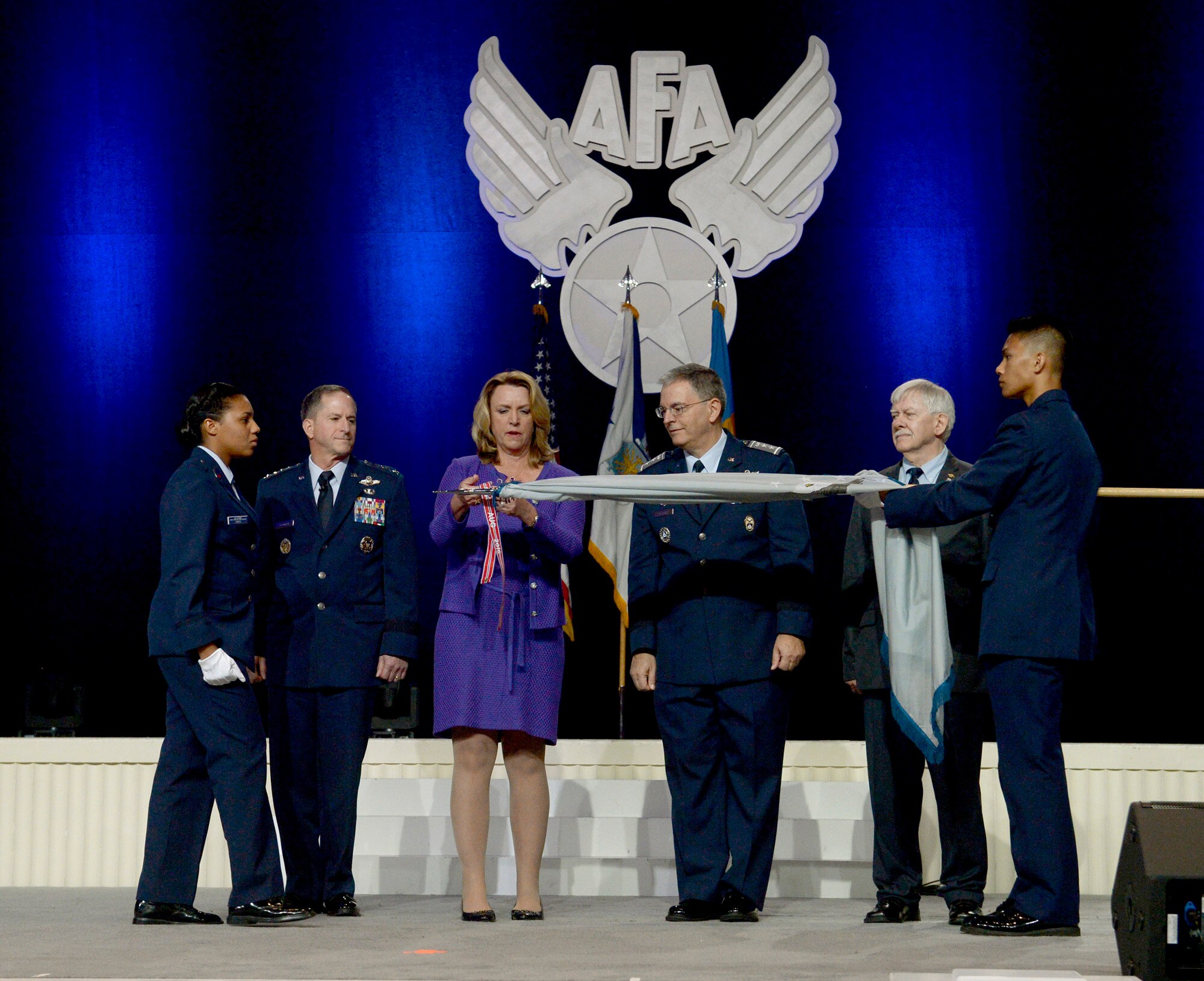 Maj. Gen. Joseph Vazquez, the Civil Air Patrol national commander, accepts the Air Force Organizational Excellence Award on behalf of the CAP from Air Force Secretary Deborah Lee James and Air Force Chief of Staff Gen. Dave Goldfein during the Air Force Association's Air, Space and Cyber Conference in National Harbor, Md., Sept. 20, 2016.  (U.S. Air Force photo/Scott M. Ash)