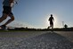 Mulberry Island Half Marathon participants approach Back River Road at Joint Base Langley-Eustis, Va., Sept. 17, 2016. The course took participants past natural views and historic sites such as the Matthew Jones House and an early American brick factory located on Fort Eustis. (U.S. Air Force photo by Staff Sgt. Natasha Stannard/Released)