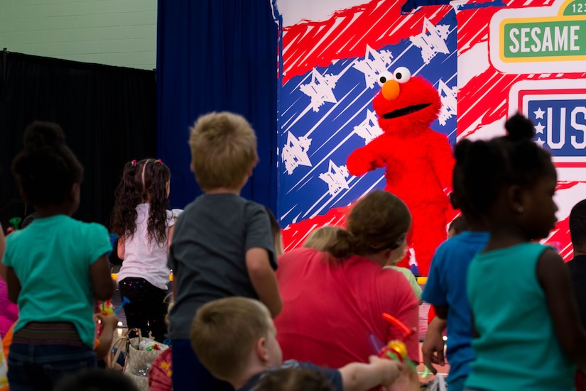 Children dance along with Sesame Street character, Elmo, during the Sesame Street/USO Experience for Military Families tour in the Fort Eustis Youth Center at Joint Base Langley-Eustis, Va., Sept. 16, 2016. The Sesame Street/USO Experience for Military Families tour made its debut in July 2008 and is the longest running entertainment tour in USO history. (U.S. Air Force photo by Staff Sgt. J.D. Strong II)