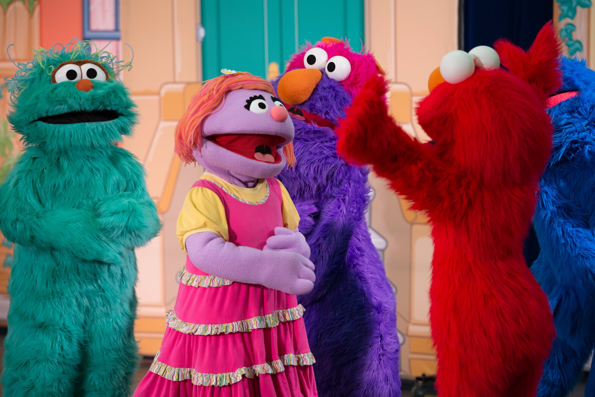 Sesame Street characters greet their friend Katie during the Sesame Street/USO Experience for Military Families tour in the Fort Eustis Youth Center at Joint Base Langley-Eustis, Va., Sept. 16, 2016. The show featured Sesame Street characters trying to cheer up military child, Katie, who is moving to a new installation and worried about making new friends.  (U.S. Air Force photo by Staff Sgt. J.D. Strong II)