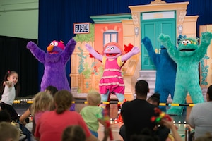 Sesame Street characters sing and dance during the Sesame Street/USO Experience for Military Families tour in the Fort Eustis Youth Center at Joint Base Langley-Eustis, Va., Sept. 16, 2016. This year marks the tour's sixth year visiting military installations in the U.S. and abroad. (U.S. Air Force photo by Staff Sgt. J.D. Strong II)