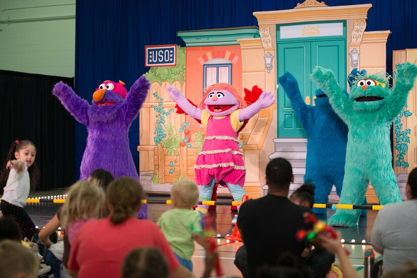 Sesame Street characters sing and dance during the Sesame Street/USO Experience for Military Families tour in the Fort Eustis Youth Center at Joint Base Langley-Eustis, Va., Sept. 16, 2016. This year marks the tour's sixth year visiting military installations in the U.S. and abroad. (U.S. Air Force photo by Staff Sgt. J.D. Strong II)