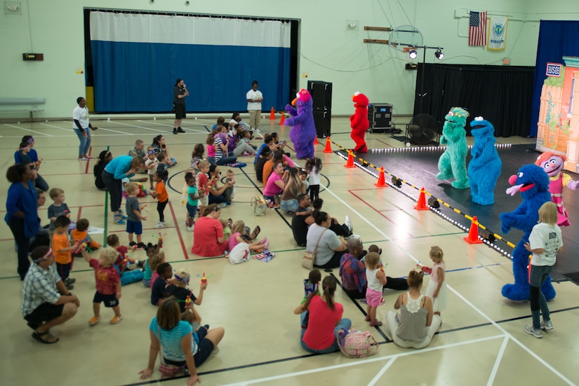 Sesame Street characters sing and interact with patrons during the Sesame Street/USO Experience for Military Families tour in the Fort Eustis Youth Center at Joint Base Langley-Eustis, Va., Sept. 16, 2016. Since its inception, the tour has taken its message to more than 540,000 troops and military families and performed more than 1,000 shows on 149 military installations in 33 states and 11 countries. (U.S. Air Force photo by Staff Sgt. J.D. Strong II)