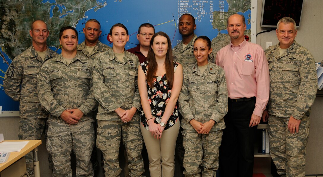 Members of 482nd Fighter Wing Emergency Operations Center pose for a photo at National Weather Service and the National Hurricane Center Miami, Florida, Sept. 15. The National Weather Service work to provide weather updates, climate data, forecast and warnings for the protection of life and property, and enhancement of the national economy. (U.S. Air Force photo by Senior Airman Aja Heiden)