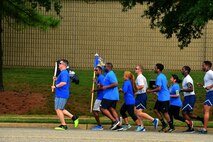 The 440th Supply Chain Operations Squadron start the POW/MIA ceremony 24-hour run at Joint Base Langley-Eustis, Va., Sept. 15, 2016. The POW/MIA flag has flown on National POW/MIA Recognition Day since 1982. (U.S. Air Force photo by Airman 1st Class Tristan Biese)