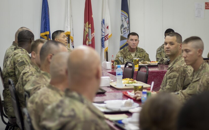Command Sgt. Maj. William Thetford, center, the senior enlisted leader of U.S. Central Command, listens to U.S. Army Central Soldiers during a luncheon Sep. 14, 2016 at Camp Arifjan, Kuwait. Thetford’s two-day visit to U.S. Army Central’s area ofoperations included briefings, meals with troops and tours of Army facilities. (U.S. Army photo by Sgt. Angela Lorden)