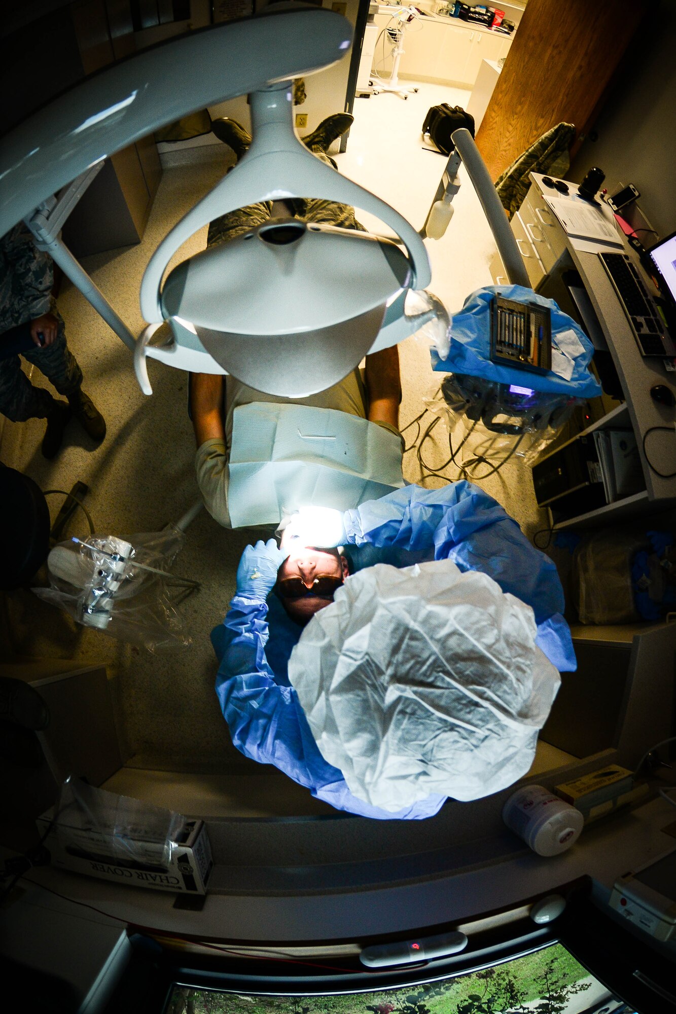 Staff Sgt. David Tierney, 2nd Dental Squadron dental technician, cleans a patient’s teeth at Barksdale Air Force Base, La., Sept. 14, 2016. After each cleaning, all tools are sterilized and stored, and a clean set of equipment is used for the next patient. (U.S. Air Force photo/Senior Airman Luke Hill)