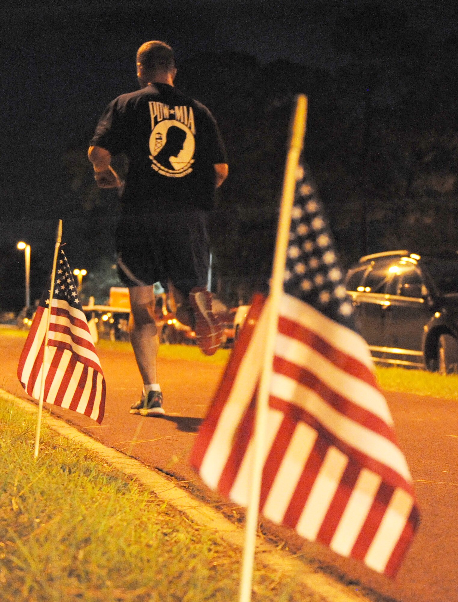 A Keesler member runs laps during Keesler’s POW/MIA 24-hour memorial run and vigil at the Crotwell Track Sept. 16, 2016, on Keesler Air Force Base, Miss. Over 400 Keesler personnel participated in the event, to include runners and readers. Participants ran more than 1,500 miles and raised $1,400, which will be donated to a POW/MIA memorial fund. (U.S. Air Force photo by Kemberly Groue/Released)