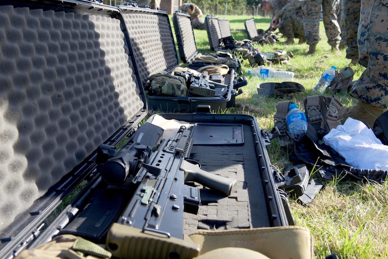 Marines with the Marine Corps Shooting Team open up weapon cases containing SA80 A2 rifles, Sept. 11, 2016, at Altcar Training Camp, Merseyside, England. The Marines will be firing these weapons during the Royal Marines Operational Shooting Competition from September 6 -22, 2016.  The U.S. Marines are competing against the Royal Netherlands Marine Corps and the Royal Marines. The U.S. Marines are with Weapons Training Battalion, Marine Corps Base Quantico, Virginia.