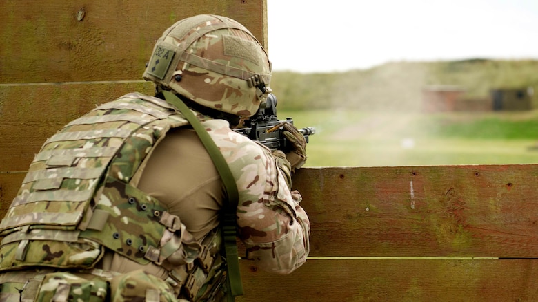 A Royal Marine fires a SA80 A2 rifle in the supported kneeling position in a practice match during the Royal Marines Operational Shooting Competition, Sept. 12, 2016, The Royal Marines are competing against and building bonds with the Royal Netherlands Marine Corps and the U.S. Marines.