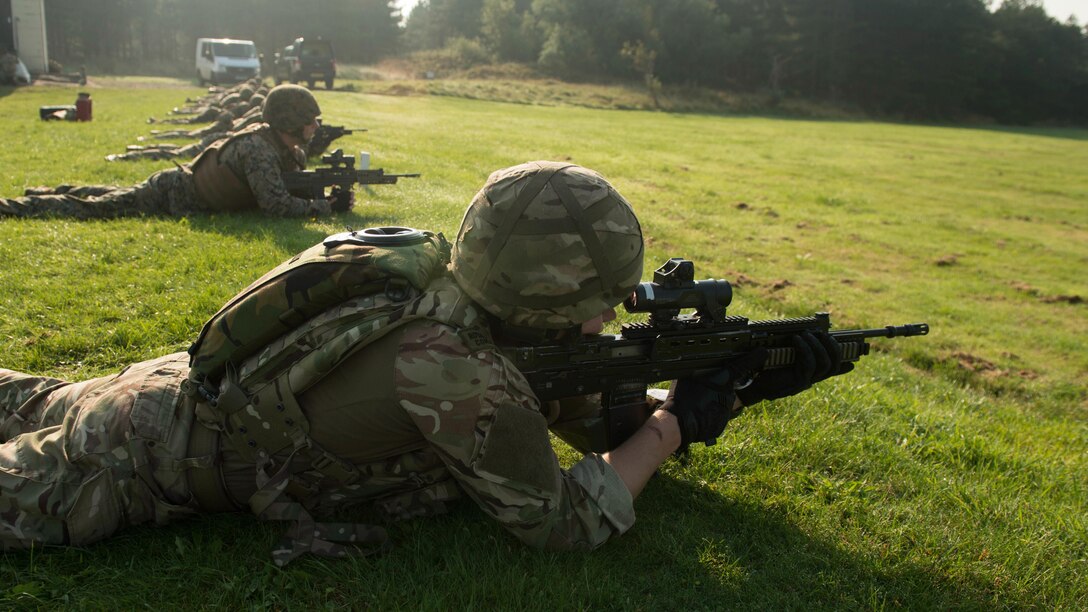 Royal Marines and U.S. Marines with the Marine Corps Shooting Team prepare to fire Sept. 14, 2016, at Altcar Training Camp, Merseyside, England. The Marines are competing in the Royal Marines Operational Shooting Competition, from September 6-22, 2016.  The U.S. Marines are competing against the Royal Netherlands Marine Corps and the Royal Marines. The U.S. Marines are with Weapons Training Battalion, Marine Corps Base Quantico, Virginia.