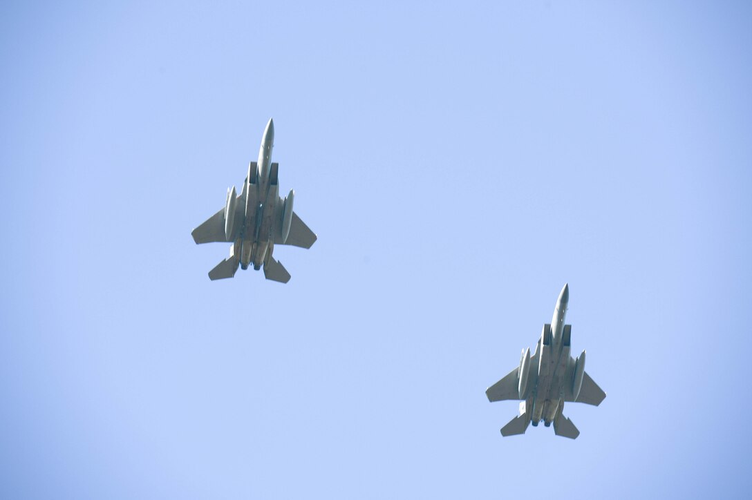 Two F-15s from the 142nd Fighter Wing, Oregon Air National Guard, fly over the Western Air Defense Sector during the F-15 static display dedication ceremony Sept. 13. The WADS has been guarding America's skies in the same
building 24/7 since 1960 and regularly uses F-15 alert aircraft to perform its mission. (U.S. Air Force photo/Senior Airman Jacob Jimenez/released)