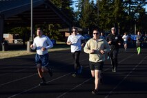 Team McChord Airmen run at the McChord outdoor track during the 24-Hour POW/MIA Run Sept. 14, 2016, at Joint Base Lewis-McChord, Wash. Team McChord Airmen ran a cumulative total of 5,397 miles over the span of 24 hours. (U.S. Air Force photo/Senior Airman Jacob Jimenez) 