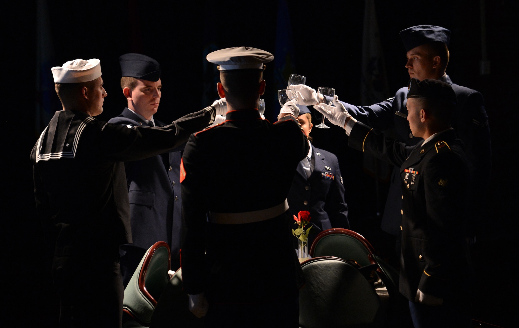 Team McChord Service Members perform a toast during the Prisoner of War/Missing in Action Remembrance luncheon Sept. 16, 2016, at Joint Base Lewis-McChord, Wash. The luncheon honored 12 former POWs and all current POW/MIA with the POW/MIA table presentation. (U.S. Air Force photo/Senior Airman Jacob Jimenez)