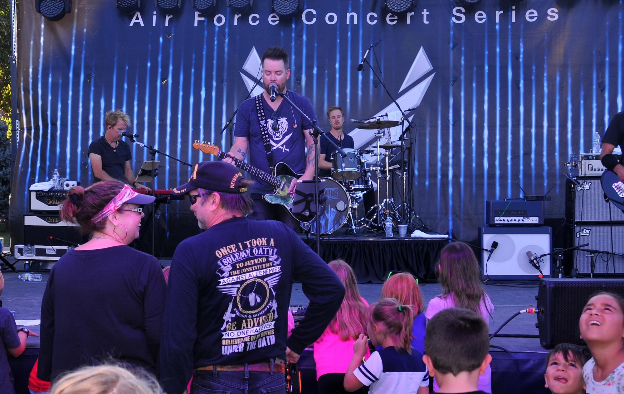 Members of Team Offutt and their families crowd the stage to see “American Idol” season seven winner David Cook during the Offutt Fall Fest, held Sept. 18, 2016 at Offutt Air Force Base, Nebraska. (U.S. Air Force photo by D.P. Heard/Released)
