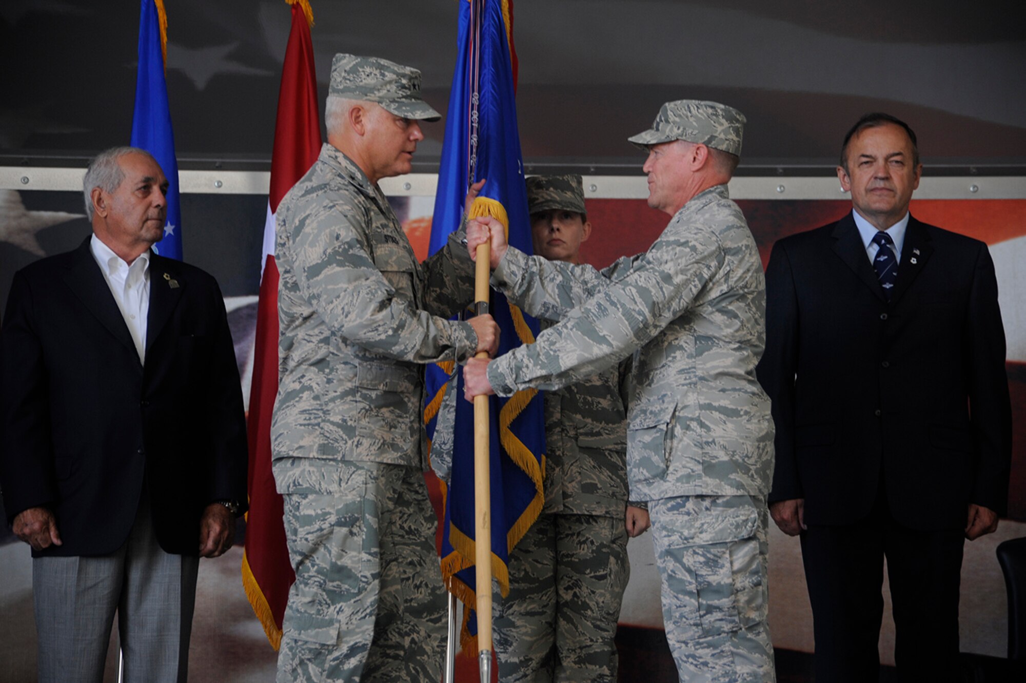 Pope Army Airfield, N.C.- Maj. Gen. John P. Stokes, Commander of the 22nd Air Force, receives the 440th Airlift Wing flag from Lt. Col. Karl Schmitkons, 440th Airlift Wing commander, during the inactivation ceremony of the 440th Airlift Wing. The 440th Airlift Wing inactivated September 18, 2016, at Pope Field, N.C. The third oldest unit in the Air Force, the 440th AW's first operational drop was in Normandy, France on D-Day. From 2007 to 2016, while based at Fort Bragg, the unit provided air support for more than 102,000 paratroopers, flew more than 27,000 hours, and supported Operations CORONET OAK, IRAQI FEREDOM, NEW DAWN, ENDURING FREEDOM, UNIFIED RESPONSE, and INHERENT RESOLVE. (US Air Force photo by Master Sgt. Kevin Brody) 
