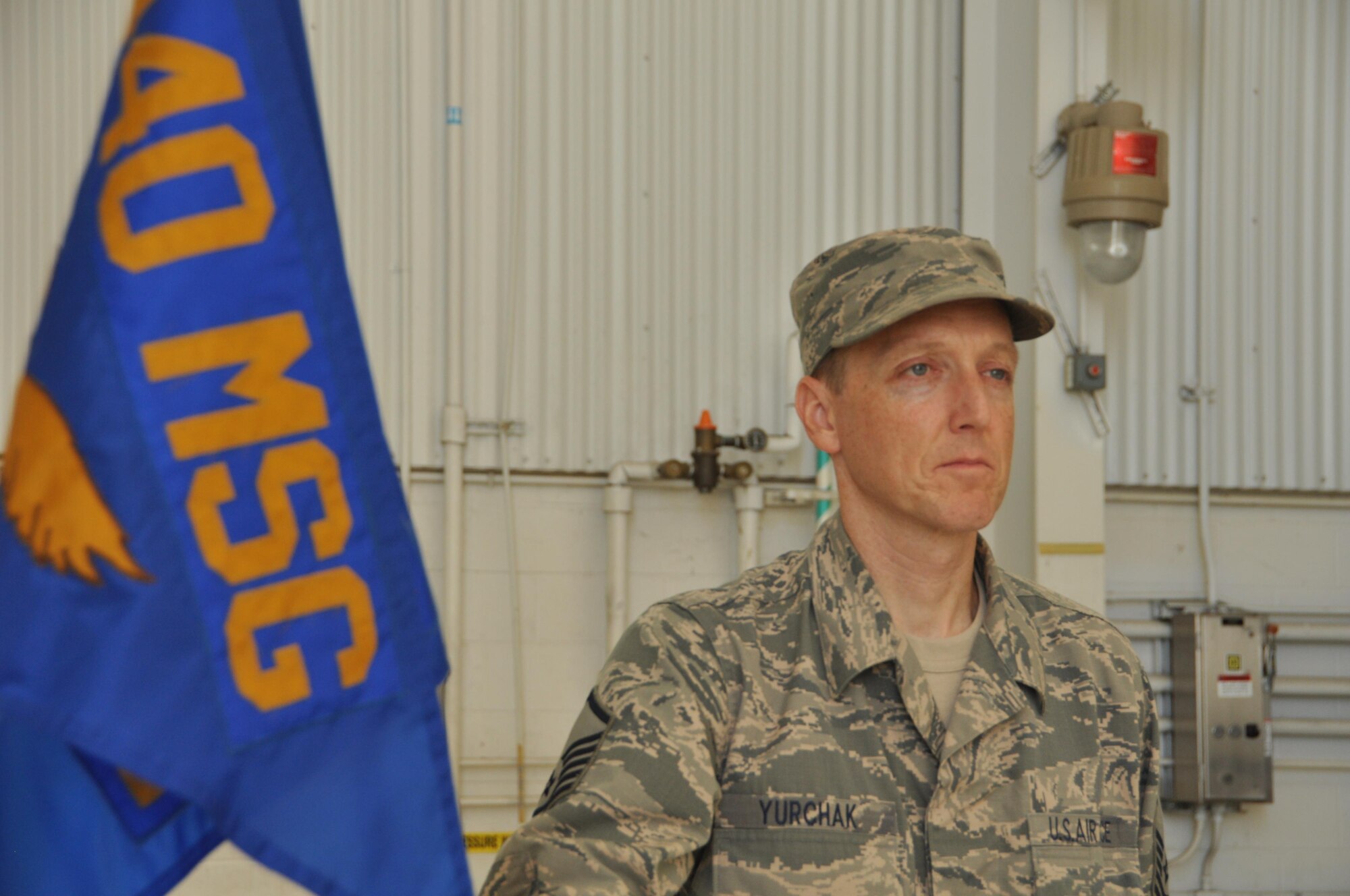 Pope Army Airfield, N.C.- Master Sgt. Thomas Yurchak stands proudly holding the 440th Logistics Readiness Squadron guidon a final time before it is retired during the inactivation ceremony of the 440th Airlift Wing on September 18, 2016. The third oldest unit in the Air Force, the 440th AW's first operational drop was in Normandy, France on D-Day. From 2007 to 2016, while based at Fort Bragg, the unit provided air support for more than 102,000 paratroopers, flew more than 27,000 hours, and supported Operations CORONET OAK, IRAQI FEREDOM, NEW DAWN, ENDURING FREEDOM, UNIFIED RESPONSE, and INHERENT RESOLVE. (US Air Force photo by Allison Janssen) 
