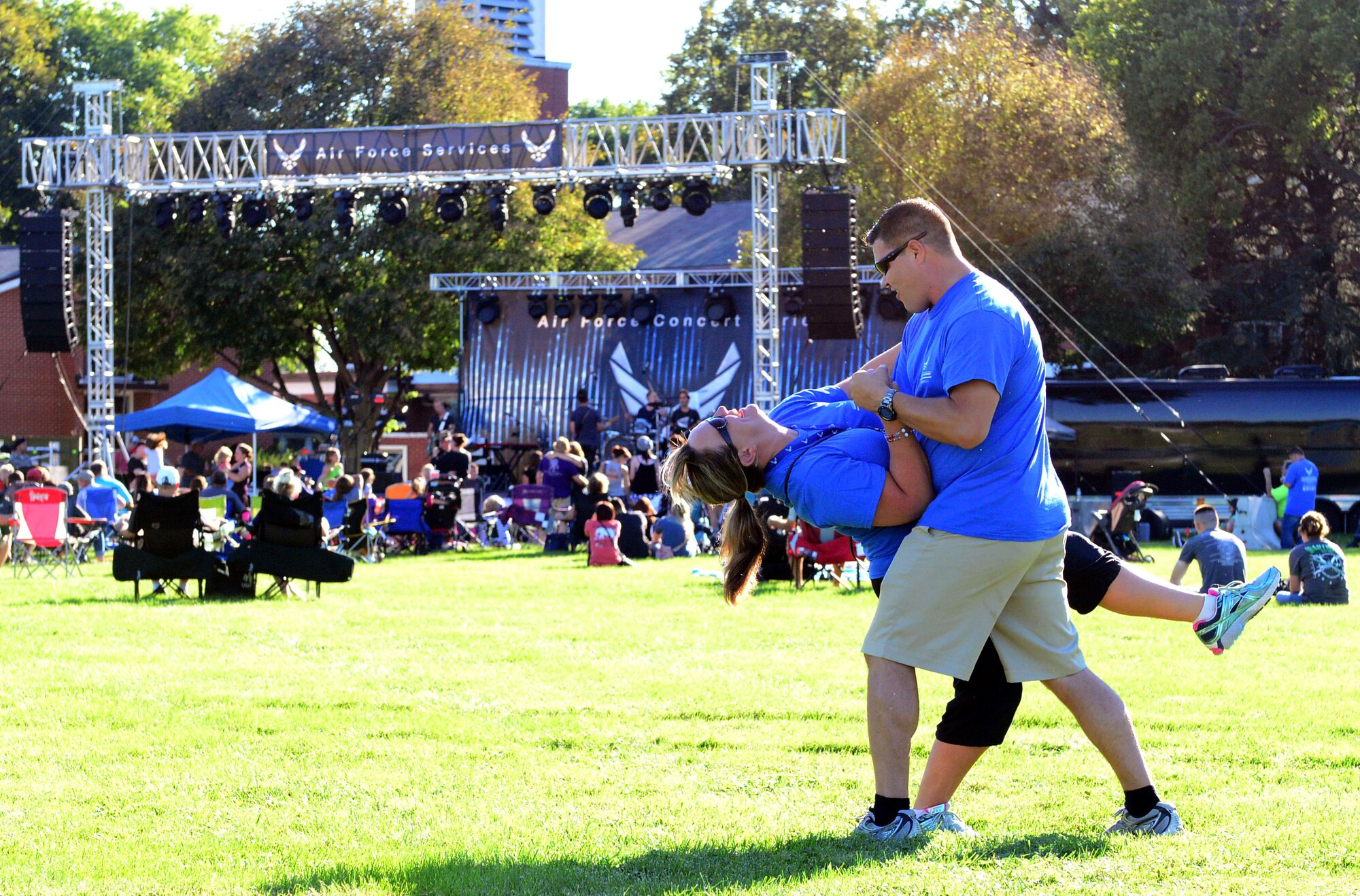 Members of Team Offutt and their families get into the swing of things as David Cook, singer, songwriter and “American Idol” season seven winner, performs at the 2016 Offutt Fall Fest, held Sept. 18, 2016 at Offutt Air Force Base, Nebraska. The concert was the thirteenth stop on a 16-base tour scheduled through the entertainment program of the Air Force Services Activity. The event included a concert, headlined by “American Idol” winner David Cook, as well as food trucks and children’s activities to include bouncy castles, face painting and sumo wrestling. (U.S. Air Force photo by Drew Nystrom/Released)