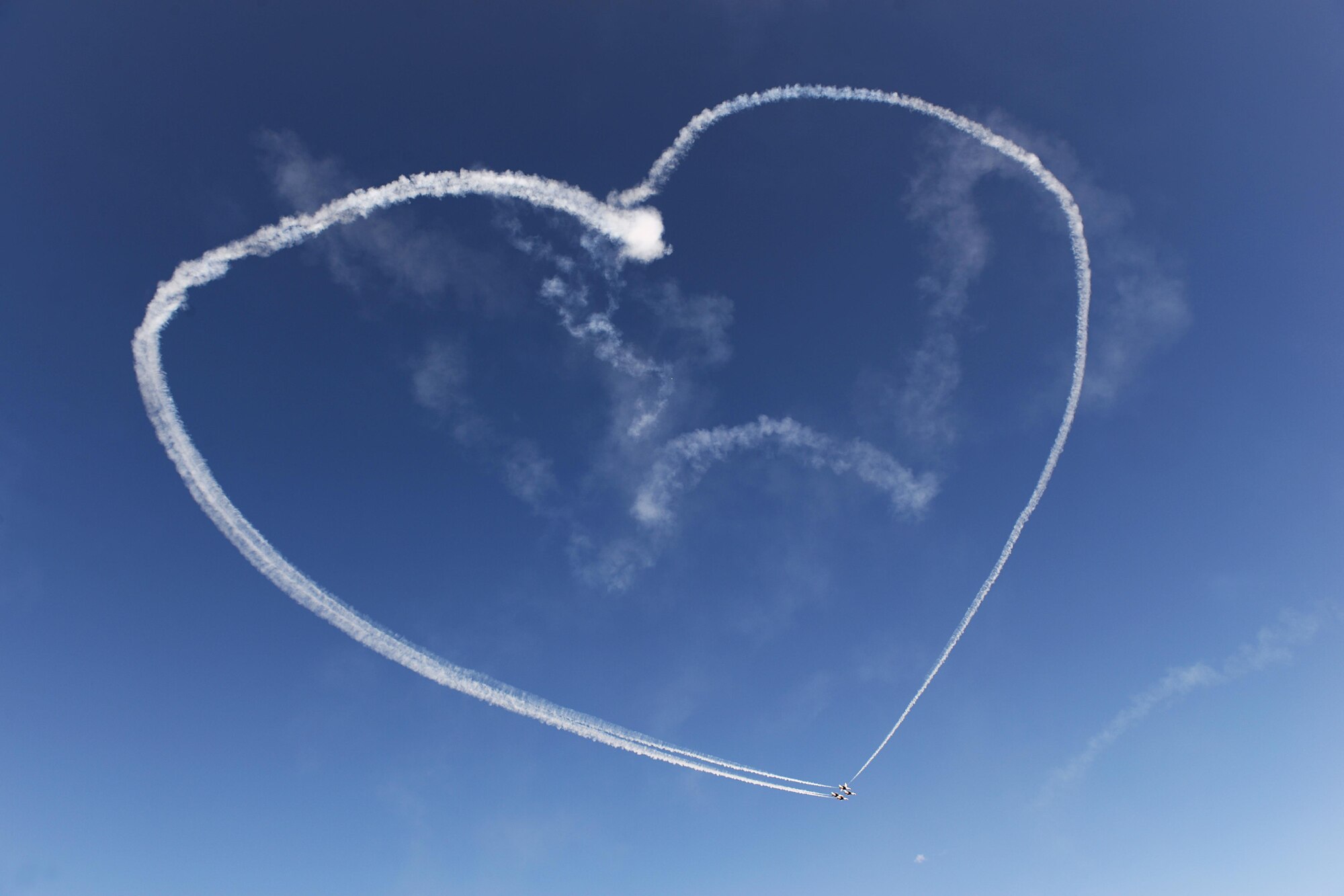 The U.S. Air Force Thunderbirds form a heart for deployed Airmen and their families during the Sheppard Air Force Base, Texas, 75th Anniversary Air Show, Sept. 17, 2016. Since 1953, the Thunderbirds have performed for millions of people across the United States, spreading the word about the U.S. Air Force and its precision, skill and decisive combat power. (U.S. Air Force photo by Senior Airman Kyle E. Gese)
