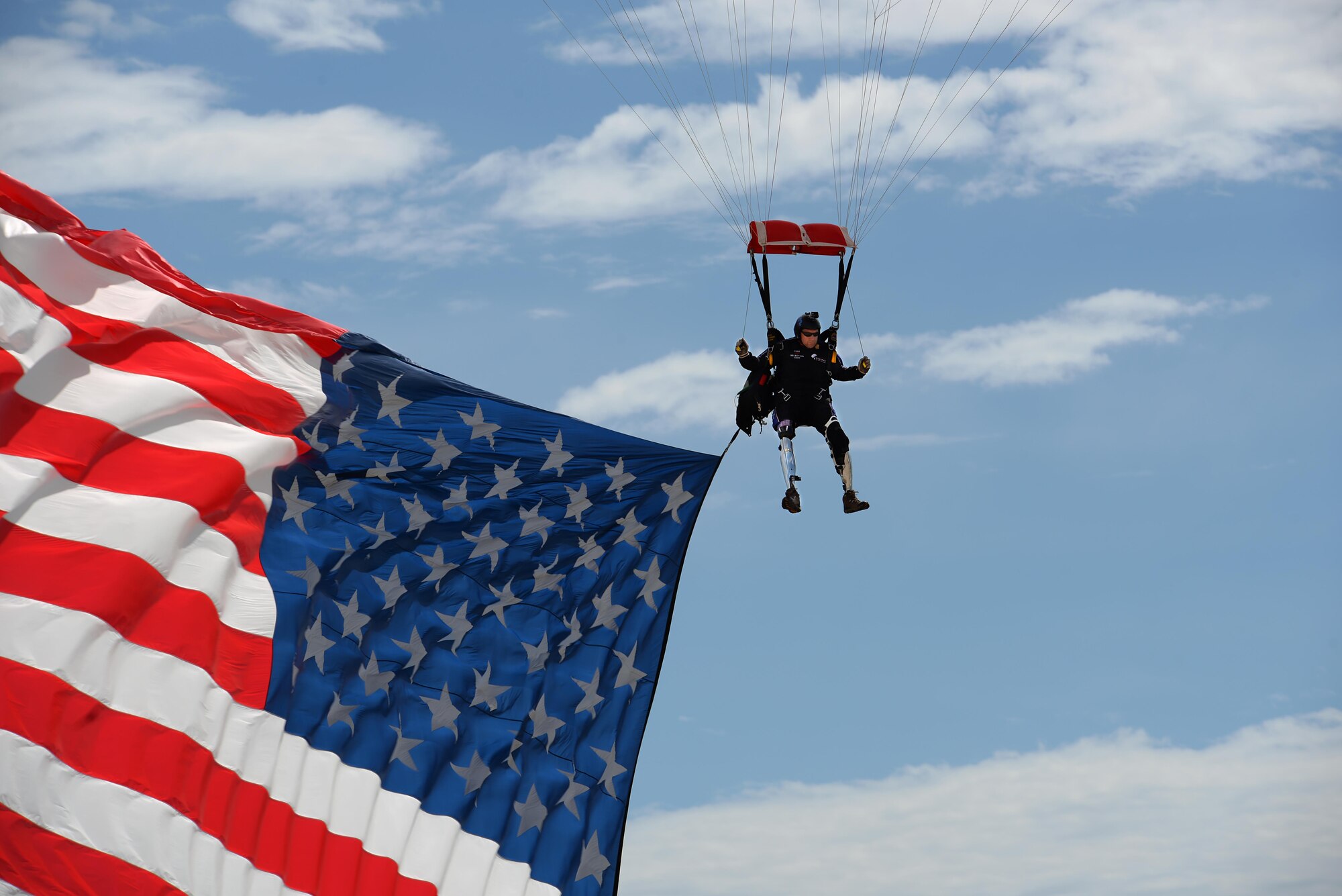 Dana Bowman, retired sergeant first class with the U.S. Army and well-renowned skydiver, descends on Sheppard Air Force Base, Texas, Sept. 17, 2016. Bowman jumped along with the Air Force Wings of Blue Parachute Team to open the 75th Anniversary Air Show celebration. (U.S. Air Force photo by Senior Airman Kyle E. Gese)