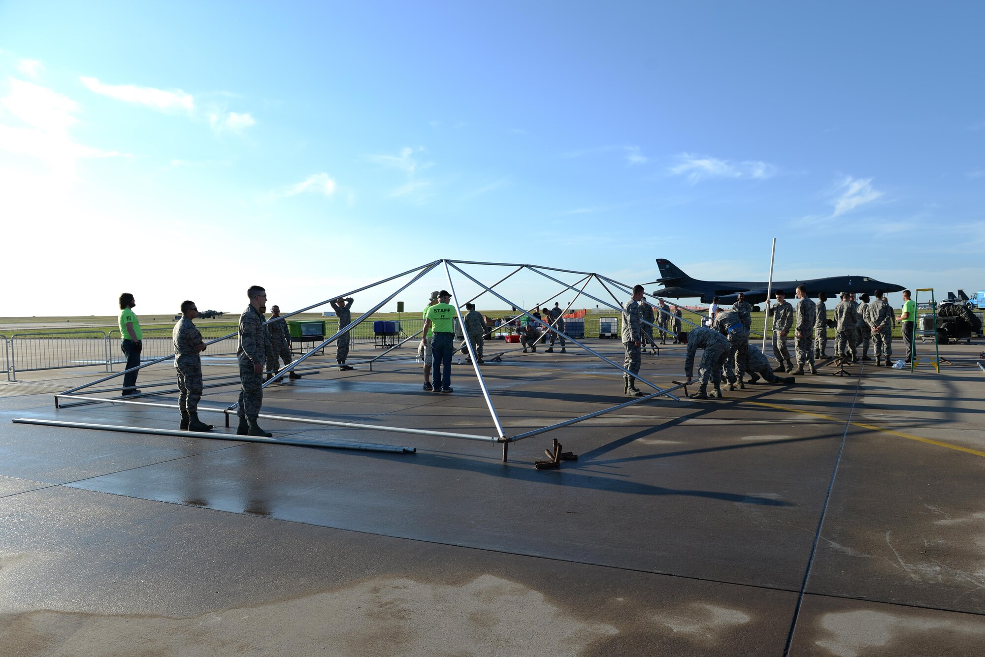 U.S. Air Force Airmen help set up tent poles after a storm blew down nearly every tent for the Sheppard Air Force Base, Texas, Open House and Air Show, Sept. 18, 2016. More than 2,000 Airmen in Training gathered to help reset the base for the 75th Anniversary Air Show Celebration. (U.S. Air Force photo by Senior Airman Kyle E. Gese)