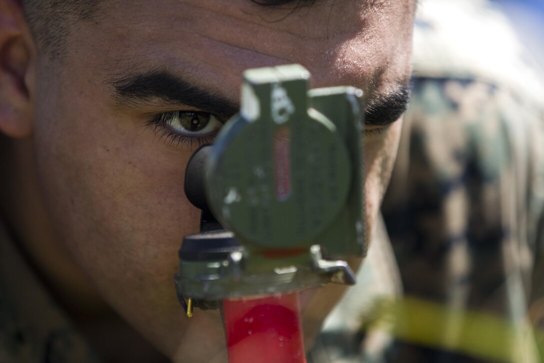 Lance Cpl. Fernando A. Castillo, a mortarman with Weapons Company, Battalion Landing Team, 2nd Battalion, 4th Marine Regiment, 31st Marine Expeditionary Unit, aligns targeting reference points to ensure accurate fire with 81 mm mortars during training on Farallon de Medinilla Range, Commonwealth Northern Mariana Islands, Sept. 16, 2016. The mortarmen fired nearly 100 81 mm mortar rounds during training on the uninhabited targeting range as part of Valiant Shield 16. Valiant Shield 16 is a biennial field training exercise designed to develop the integration of joint U.S. forces. The training enables real-world proficiency of joint forces to detect, locate, track and engage units – at sea, in the air, on land, and in cyberspace – to prepare for a range of possible military operations. 