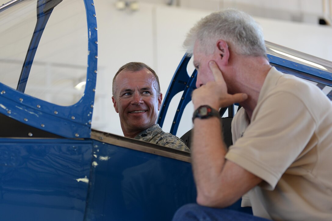 Lt. Col. Ash Cannon, 75th Anniversary Open House and Air Show director, explores the cockpit of a Fairchild PT-19 aircraft that was on display at Sheppard Air Force Base, Texas, Sept. 18, 2016. The celebration had numerous displays and performers such as the Tora Tora Tora Pearl Harbor reenactment, the Air Force Wings of Blue, skydiver Dana Bowman, Viper Air Show jet car and solo demo, Randy Ball’s Mig 17 and Vietnam T-37 demo, Kent Pietsch Jelly Belly comedy air act, Texas Raiders B-17 WWII demo, Freedom Flyers P-51 WWII demo, and the world-famous U.S. Air Force Thunderbirds. (U.S. Air Force photo by Senior Airman Kyle E. Gese)