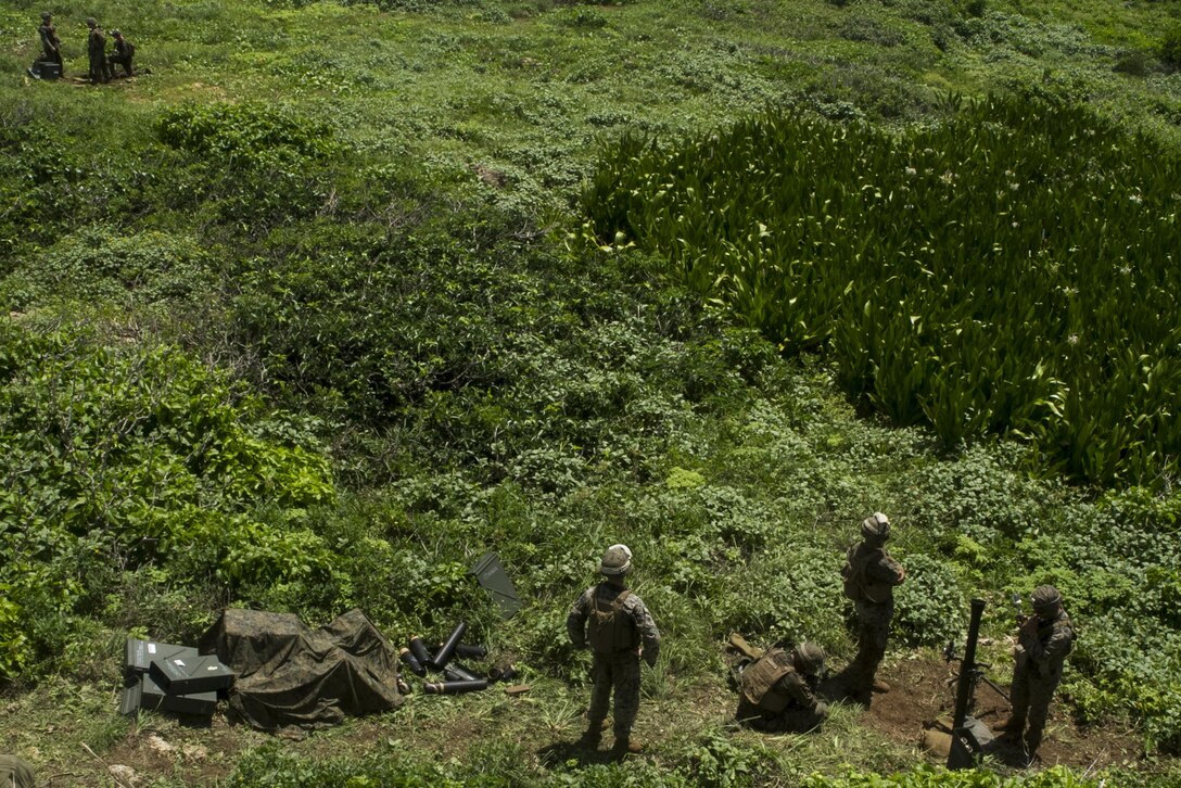 Mortarmen with Weapons Company, Battalion Landing Team, 2nd Battalion, 4th Marine Regiment, 31st Marine Expeditionary Unit, await a fire mission during 81 mm mortar-fire training on Farallon de Medinilla Range, Commonwealth Northern Mariana Islands, Sept. 16, 2016. The mortarmen fired nearly 100 81 mm mortar rounds during training on the uninhabited targeting range as part of Valiant Shield 16. Valiant Shield 16 is a biennial field training exercise designed to develop the integration of joint U.S. forces. The training enables real-world proficiency of joint forces to detect, locate, track and engage units – at sea, in the air, on land, and in cyberspace – to prepare for a range of possible military operations. 