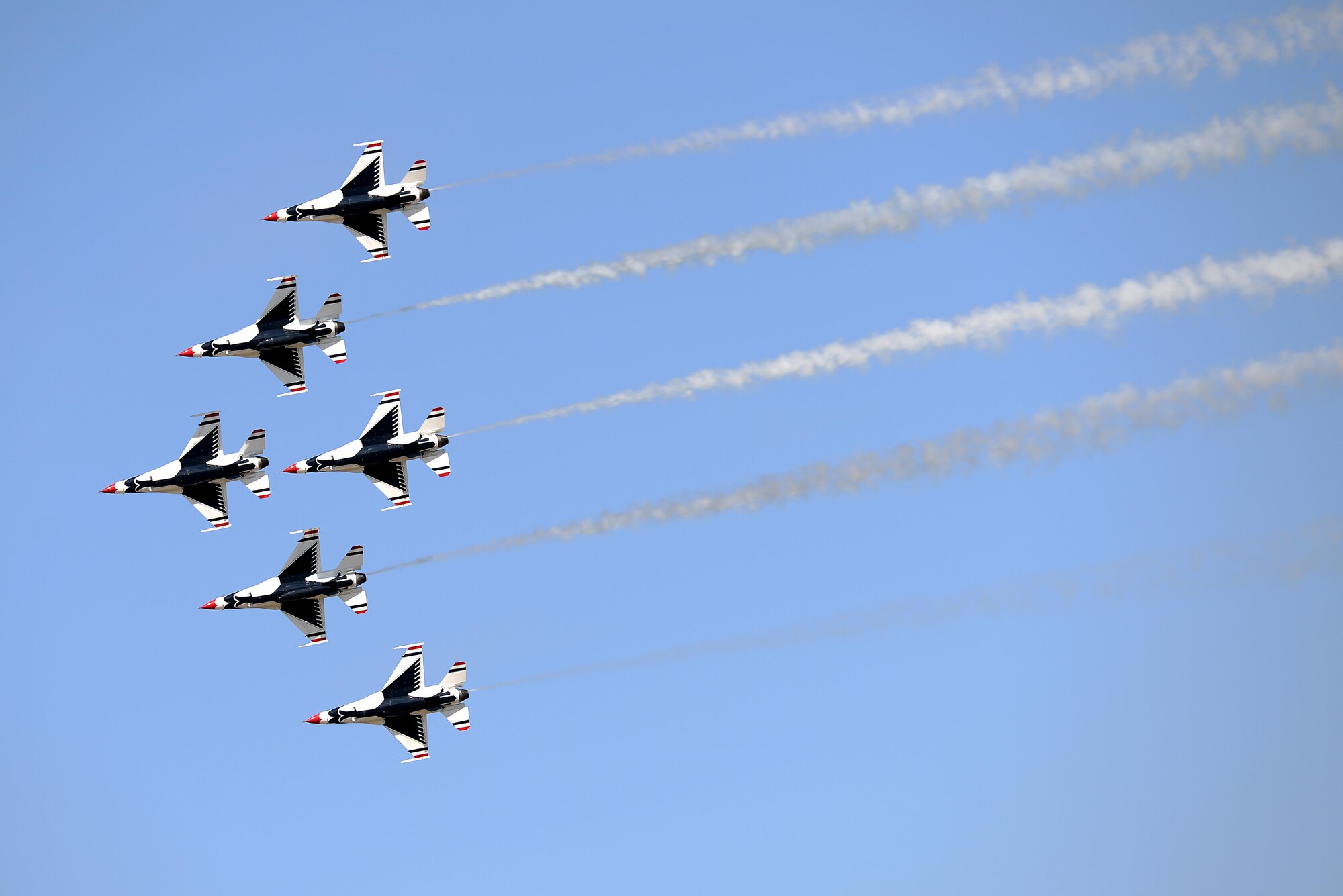All six U.S. Air Force Thunderbirds fly in a close air formation during the Sheppard Air Force Base, Texas, 75th Anniversary Air Show Celebration, Sept. 17, 2016. The Thunderbirds showcase the skill and precision of the brave aviators, maintenance and support Airmen who deploy abroad to defend our nation and its allies. (U.S. Air Force photo by Senior Airman Kyle E. Gese)