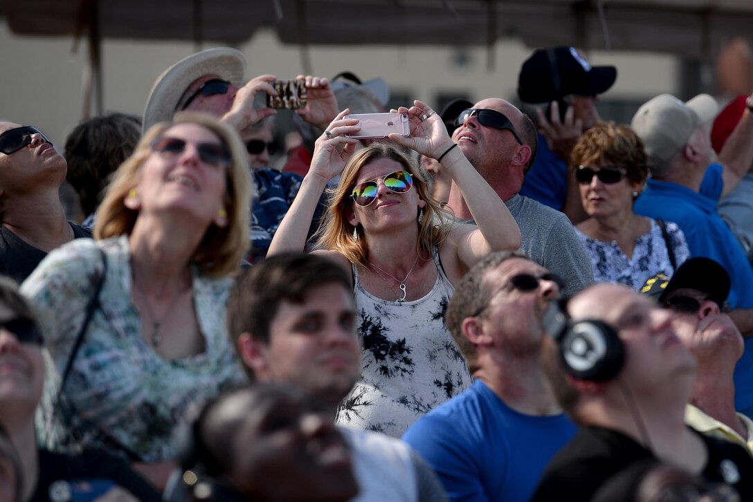 Ginger Gese takes pictures of the U.S. Air Force Thunderbirds performance during the Sheppard Air Force Base, Texas, 75th Anniversary Air Show Celebration, Sept. 17, 2016. The Air Force Thunderbirds are a demonstration team that displays the pride, precision and professionalism of American Airman. They are scheduled to appear in nearly 40 shows in 2016. (U.S. Air Force photo by Senior Airman Kyle E. Gese)