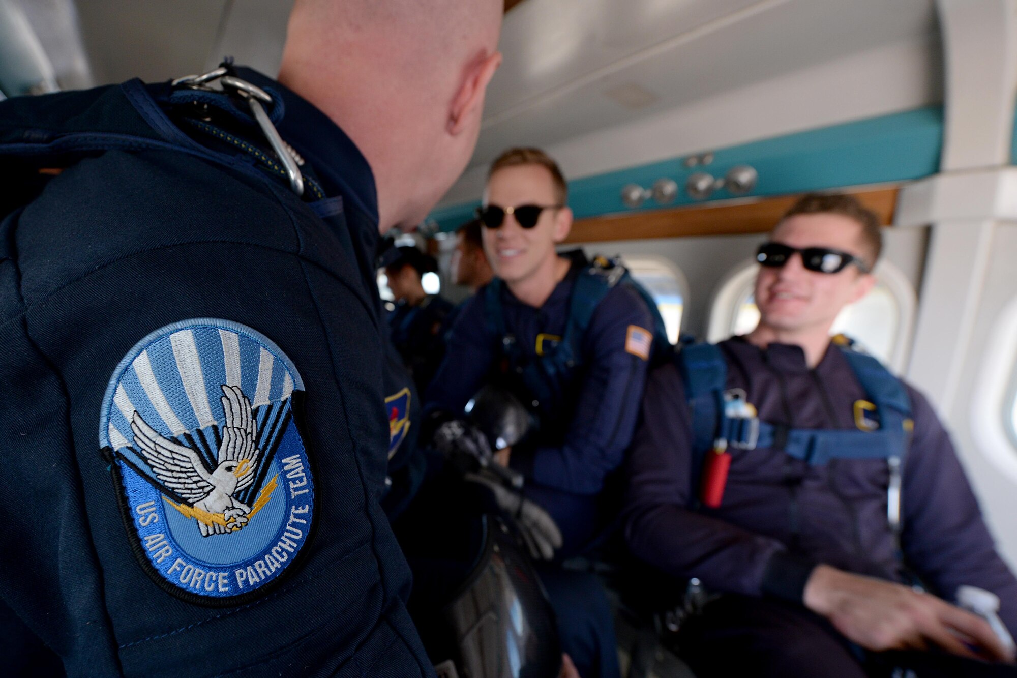 The U.S. Air Force Wings of Blue parachute team prepares to exit a UV-18B Twin Otter aircraft during the Sheppard Air Force Base, Texas, practice air show, Sept. 16, 2016. The team of jumpers performed several different maneuvers from different heights as part of the 75th Anniversary Air Show celebration. (U.S. Air Force photo by Senior Airman Kyle E. Gese)