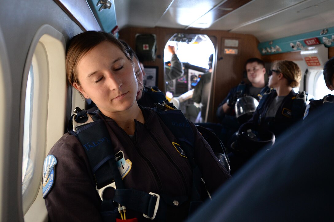 Air Force Cadet Amy Ferguson waits to jump from a UV-18B Twin Otter aircraft with the U.S. Air Force Wings of Blue parachute team during the Sheppard Air Force Base, Texas, practice air show, Sept. 16, 2016. The team of jumpers performed several different maneuvers from different heights as part of the 75th Anniversary Air Show celebration. (U.S. Air Force photo by Senior Airman Kyle E. Gese)