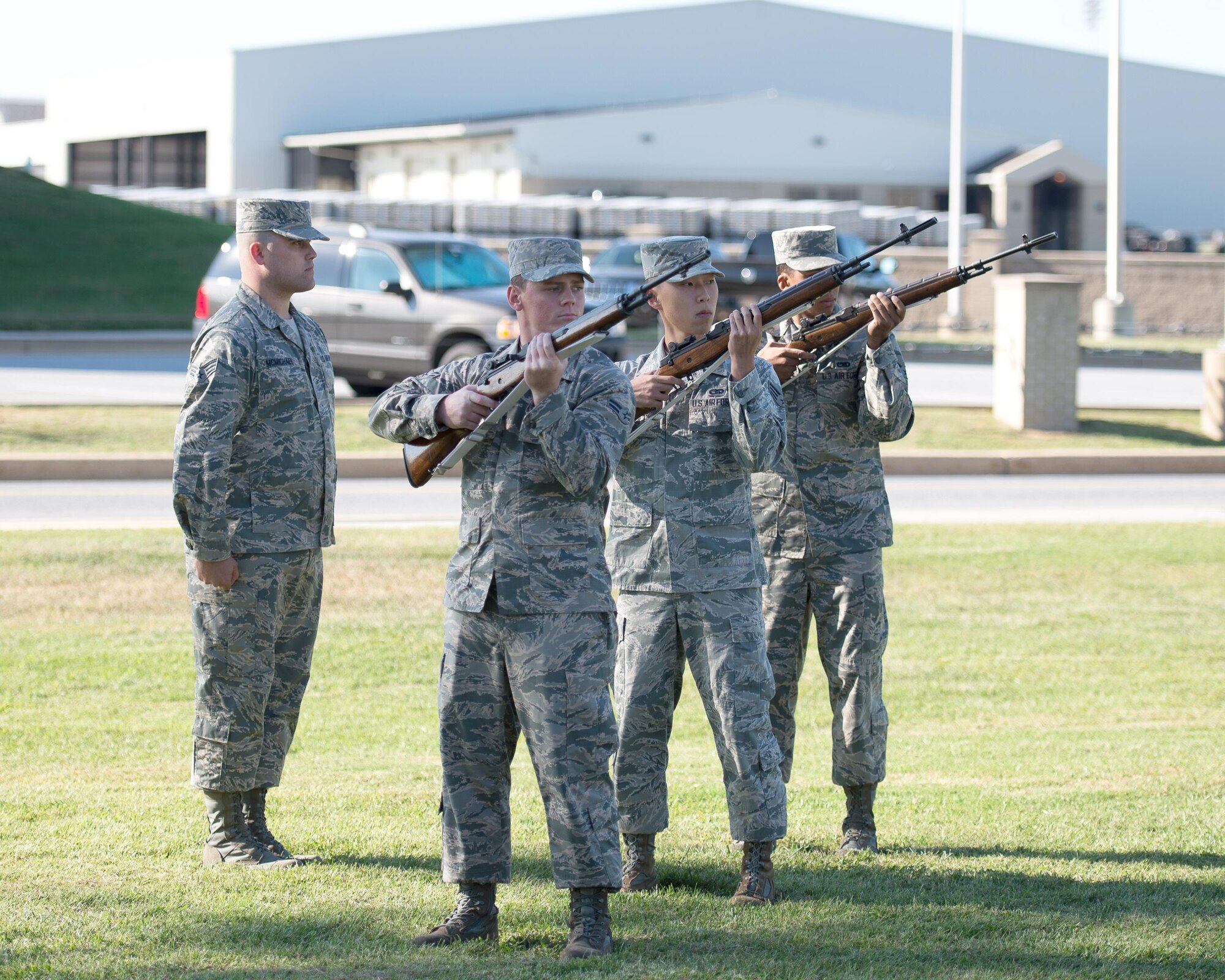 The Dover Air Force Base Honor Guard fires a volley salute during the National POW/MIA Recognition Day Ceremony Sept. 16, 2016, at Dover Air Force Base, Del. The observance featured a 10-hour standing vigil, a 24-hour run and concluded with a ceremony to honor American prisoners of war, service members repatriated in 2016 and those still missing in action. (U.S. Air Force photo by Mauricio Campino)