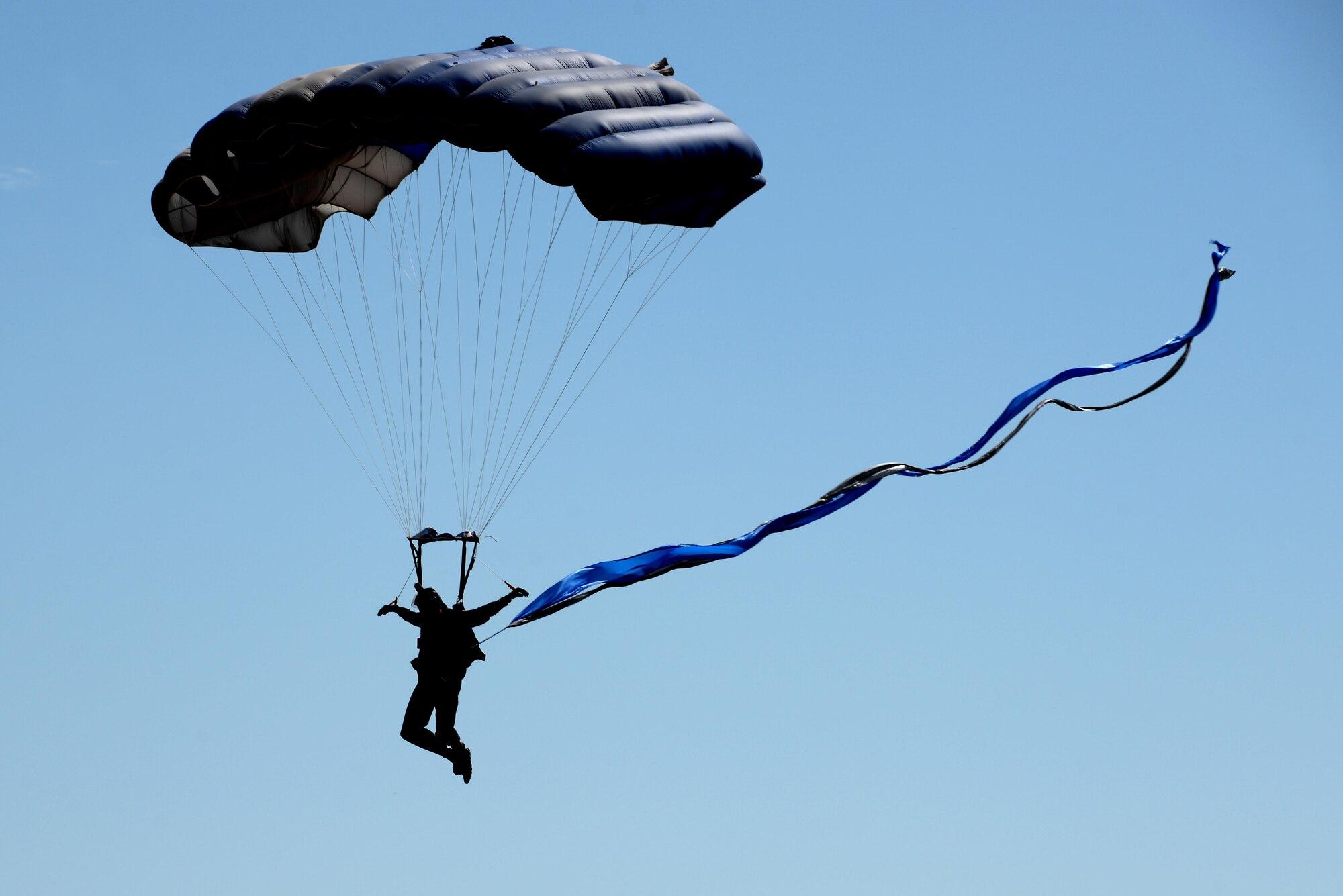 A member of the U.S. Air Force Wings of Blue parachute team descends on Sheppard Air Force Base, Texas, during the 75th Anniversary Air Show Celebration, Sept. 17, 2016. The Wings of Blue opened the Air Show with a demonstration with Dana Bowman, retired sergeant first class with the U.S. Army and well-renowned skydiver. (U.S. Air Force photo by Senior Airman Kyle E. Gese)