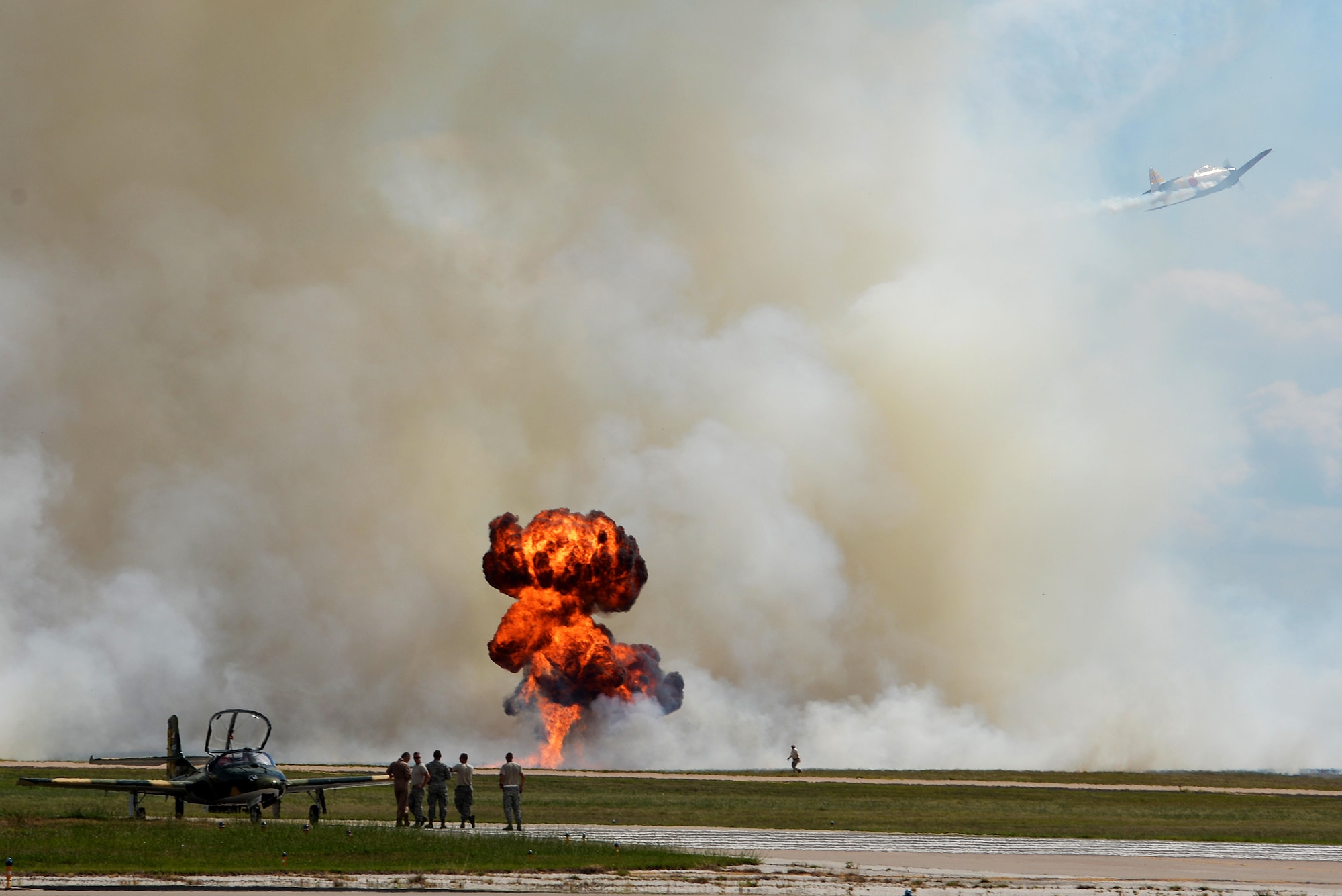 A Tora Tora Tora Mitsubishi A6M Japanese WWII attack plane flies along the runway as it reenacts the Dec. 7, 1941, attack on Pearl Harbor, for the Sheppard Air Force Base, Texas, 75th Anniversary Air Show, Sept. 17, 2016. Tora Tora Tora began in 1972 when six replica Japanese aircraft were donated to the Commemorative Air Force. They now continue to reenact the attack on Pearl Harbor as a memorial to soldiers on both sides who gave their lives for their countries. (U.S. Air Force photo by Senior Airman Kyle E. Gese)