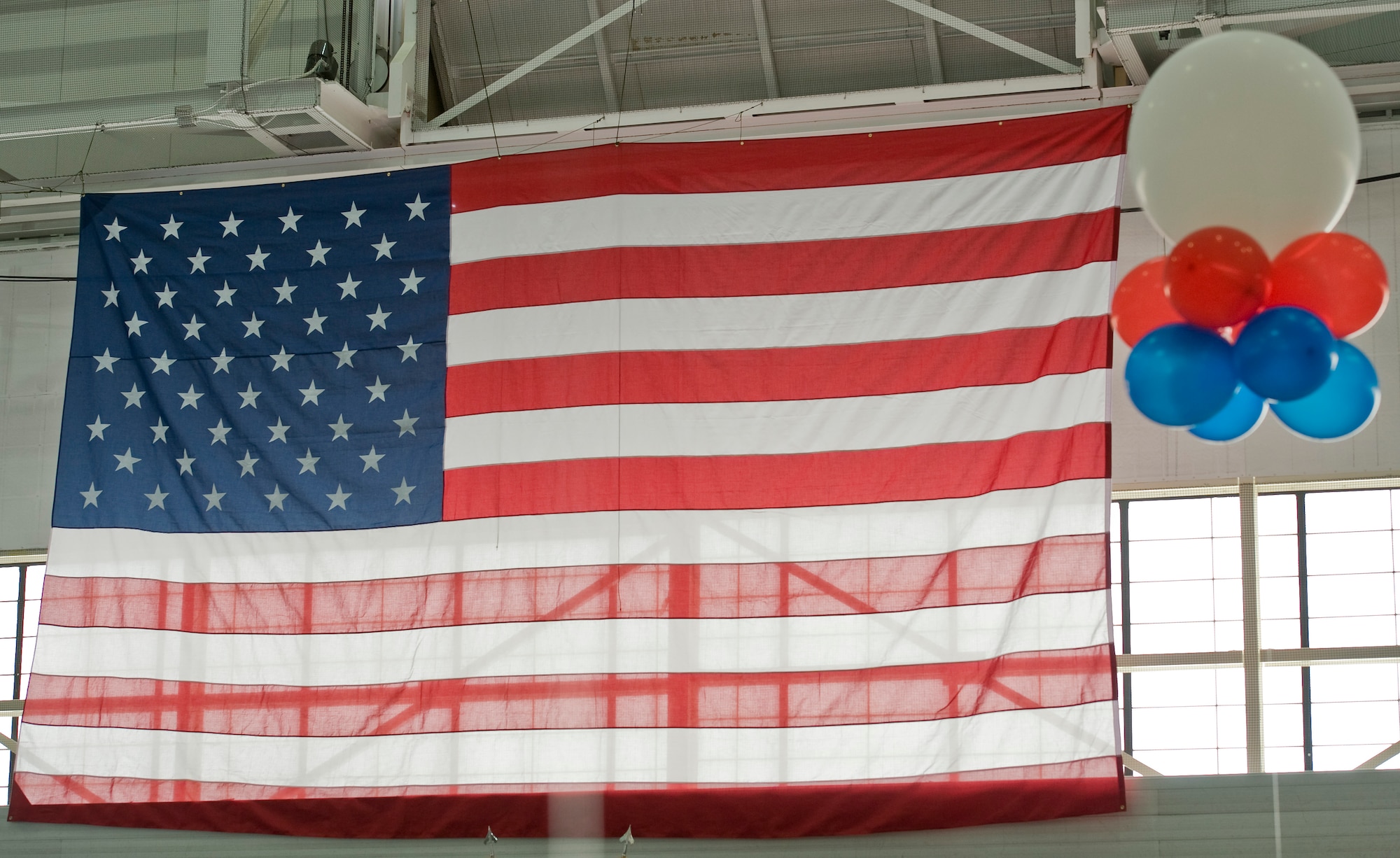 The U.S. flag hangs above the stage during the 2016 Air Force Ball at Minot Air Force Base, N.D., Sept. 17, 2016. The ball is an annual Air Force-wide tradition to celebrate the heritage and history of the Air Force. (U.S. Air Force photo/Airman 1st Class Jonathan McElderry)