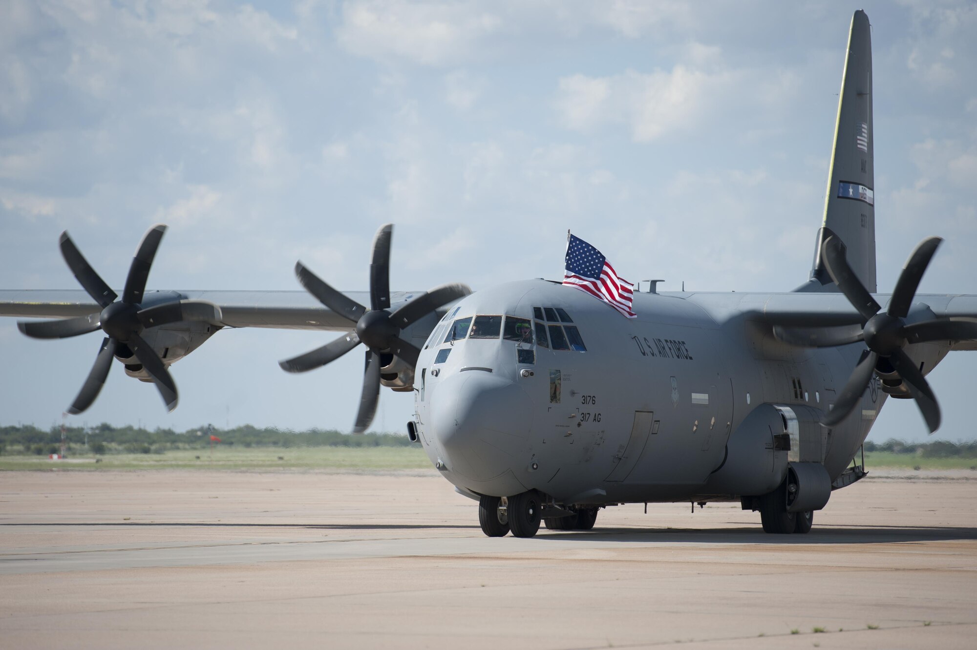 A U.S. Air Force C-130J Super Hercules from the 317th Airlift Group taxis on the flightline at Dyess Air Force Base, Texas, Sept. 19, 2016. Three C-130J’s and 67 Airmen from the 317th AG and 7th Bomb Wing returned after a four-month deployment. (U.S. Air Force photo by Airman 1st Class Rebecca Van Syoc)