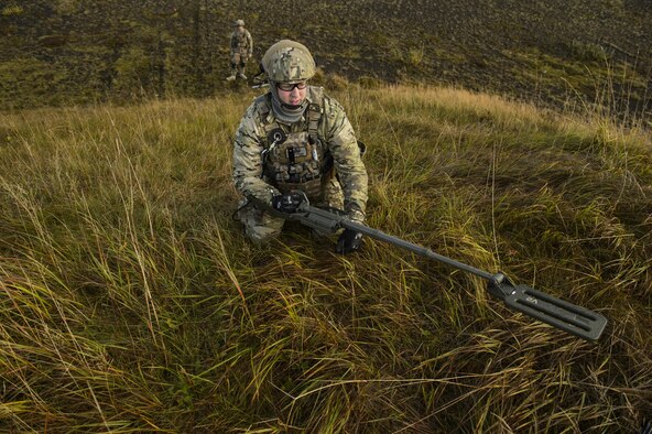 U.S. Air Force Tech. Sgt. Jason Umlauf, 52nd Civil Engineer Squadron explosive ordnance disposal craftsman, Spangdahlem Air Base, Germany, sweeps an area with a mine detector during Northern Challenge 16 exercise at Icelandic Coast Guard Keflavik Facility, Iceland, Sept. 19, 2016. The exercise focused on disabling improvised explosive devices in support of counter-terrorism tactics to prepare Partnership for Peace, NATO, and Nordic nations for international deployments and defense against terrorism. (U.S. Air Force photo by Staff Sgt. Jonathan Snyder)             